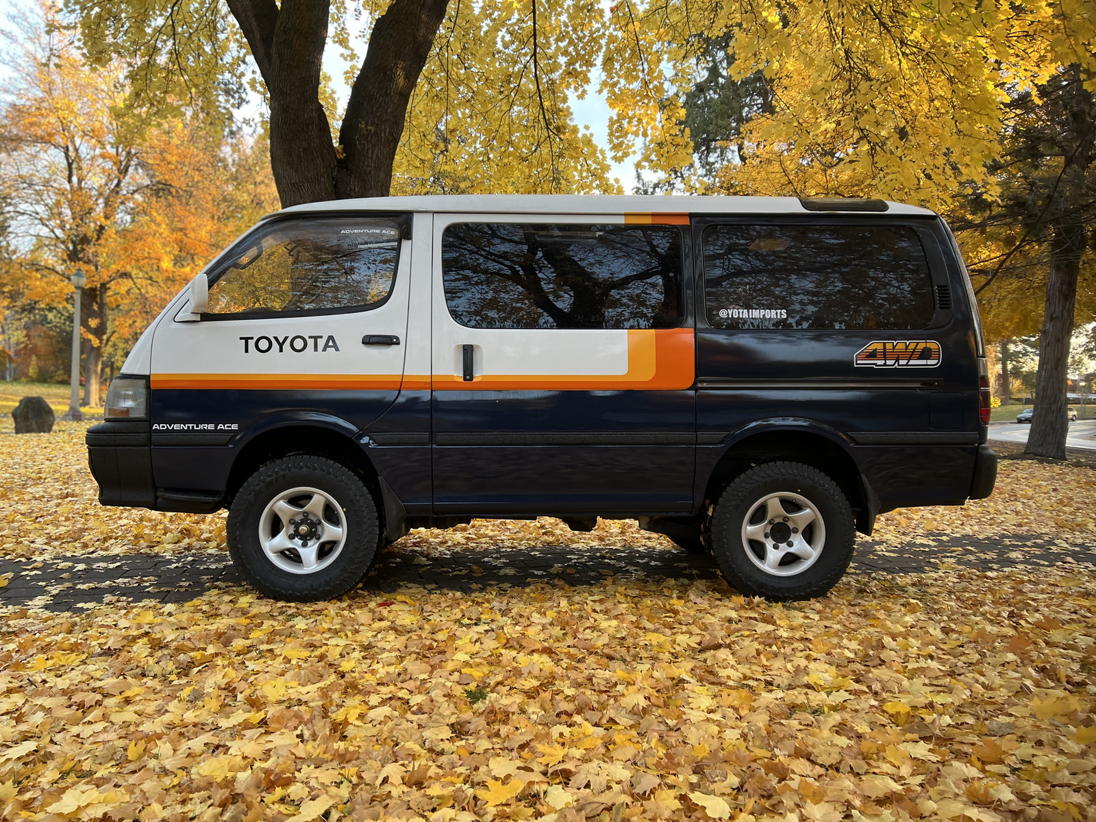 Navy Adventure Ace van in fall foliage