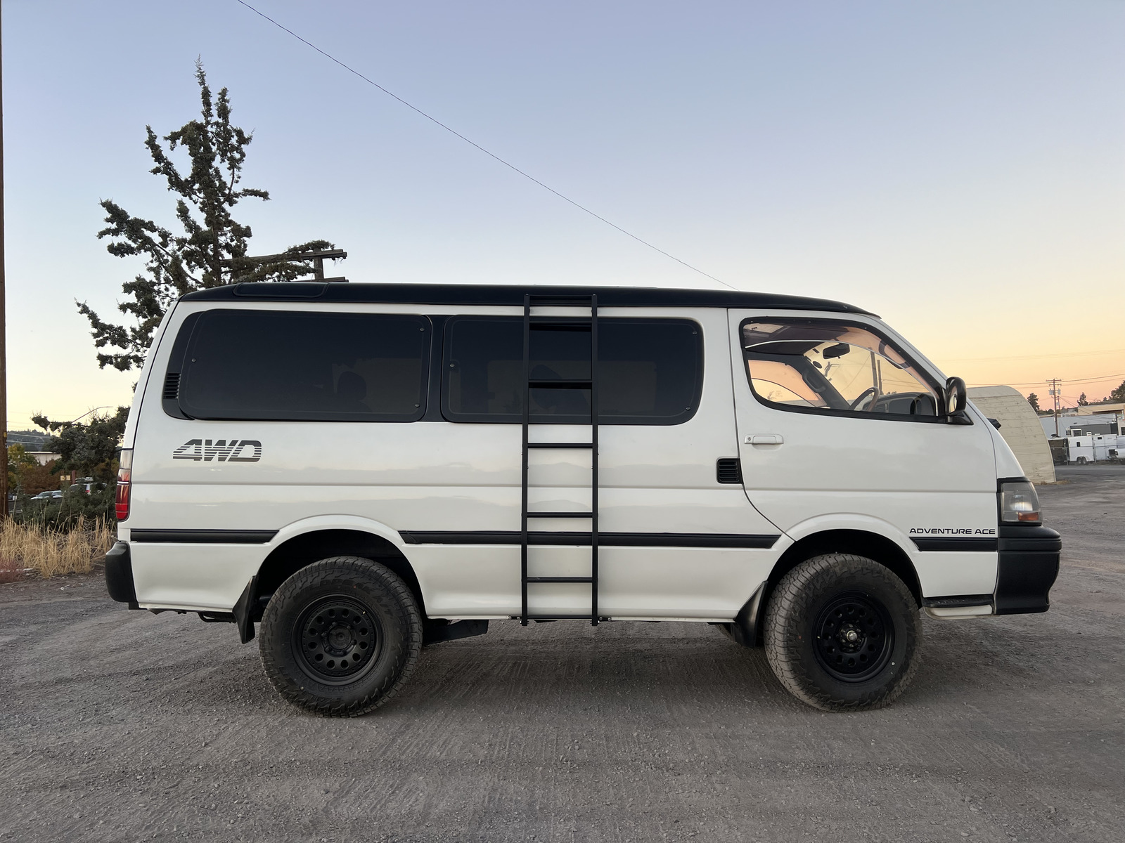 White Adventure Ace van at sunrise